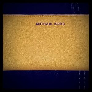 NwT yellow jet set travel clutch